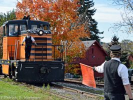 a man standing next to a train