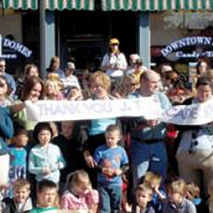 a group of people standing in front of a crowd