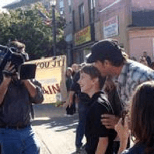 a group of people walking down a street