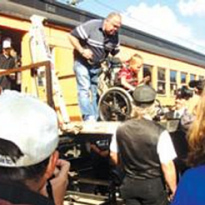 a group of people standing in front of a crowd