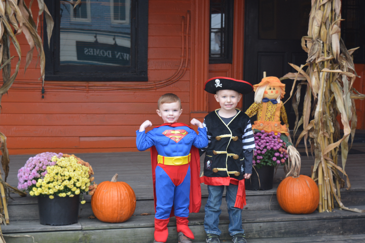a person standing in front of a fruit stand