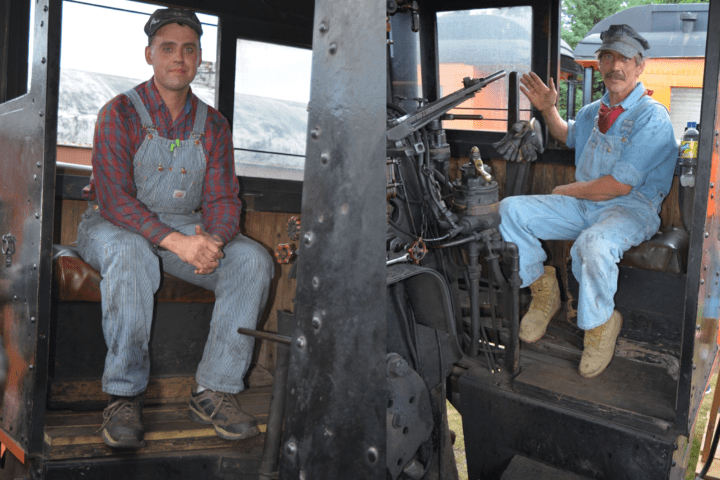 a man standing next to a truck