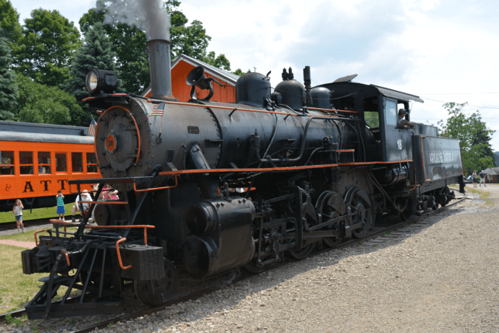 a train engine carrying carts down a track