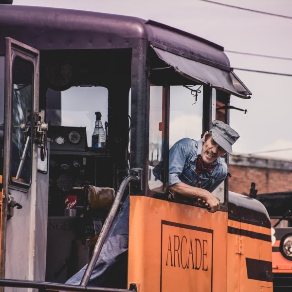 a man standing in front of a bus