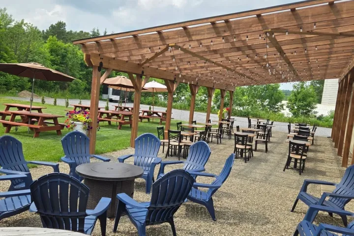 a group of lawn chairs sitting on top of a picnic table