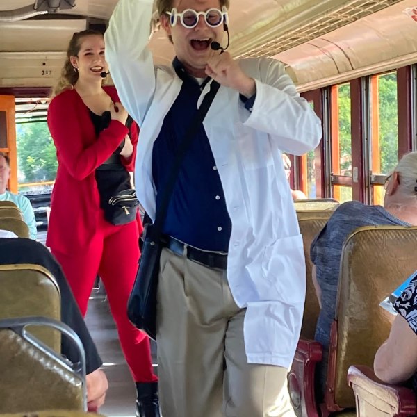 a group of people standing and talking on the phone