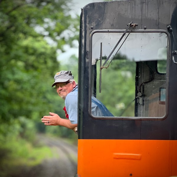 a man with an orange bus
