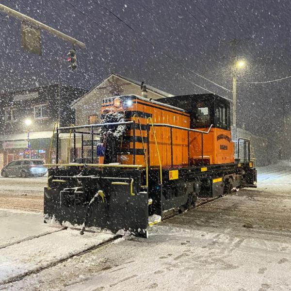 a train riding on the back of a truck
